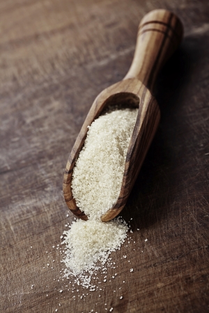 old wooden shovel with  brown sugar の写真素材