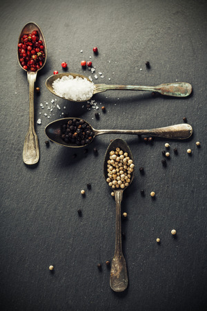 spices on slate background - cooking, healthy or vegetarian food conceptの写真素材