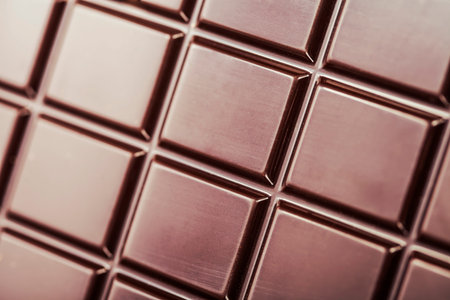dark chocolate bar as background 