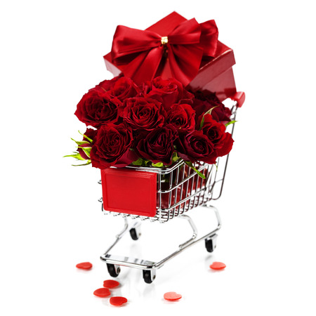 A shopping cart full with roses and gift - Valentine's day and love conceptの写真素材