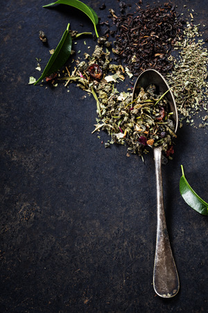 Tea composition with old spoon on dark backgroundの写真素材