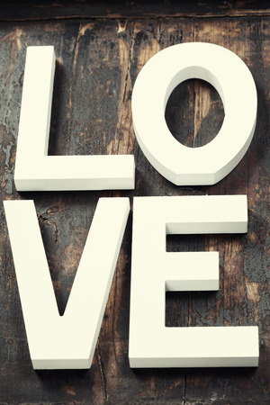 Wooden letters forming word LOVE  on wooden backgroundの写真素材