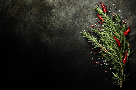 Bunch of spices on dark vintage background. Cooking, vegetarian food or health concept.の写真素材