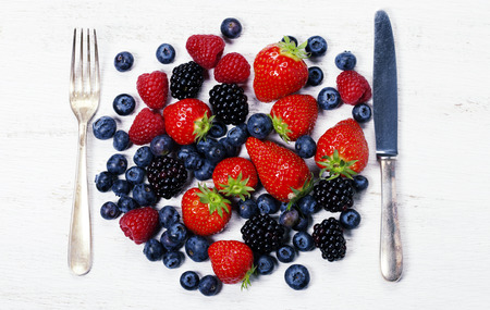 Fresh berries on old wooden backgroundの写真素材