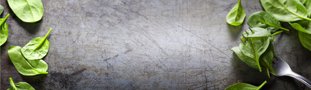 Spinach leaves on a fork - detox, diet or healthy eating conceptの写真素材