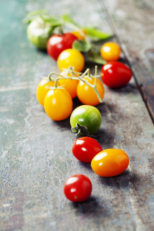 various of colorful tomatoes on wooden background. Cooking, Healthy Eating or Vegetarian conceptの写真素材