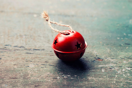 Christmas Jingle bells  on a rustic wooden background