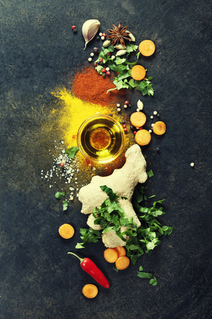 Fresh  ingredients on dark background. Vegetarian food, health or cooking concept.の写真素材