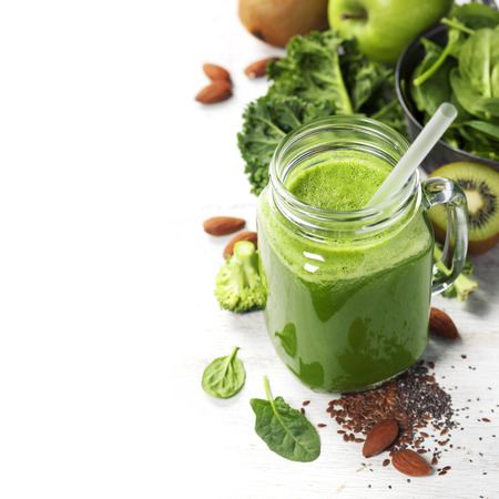 Healthy green smoothie and ingredients on white  - superfoods, detox, diet, health, vegetarian food conceptの写真素材