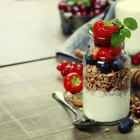 Yogurt with baked granola and berries - Healthy Breakfast conceptの写真素材