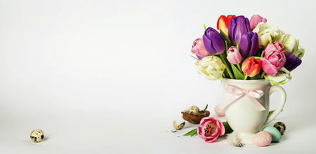 Beautiful tulips bouquet and easter eggs  - spring, easter or gardening conceptの写真素材