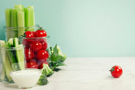assorted fresh vegetables with dip on blue background - Vegan, Vegetarian, Healthy foodの写真素材