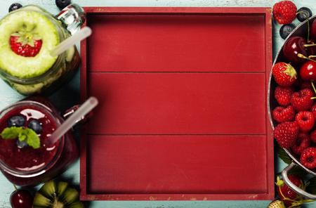 Healthy smoothies with fresh ingredients on wooden backgroundの写真素材