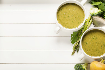 Vegetable cream soup on white rustic backgroundの写真素材