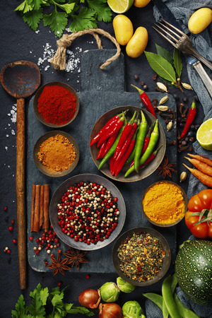 Fresh delicious ingredients for healthy cooking  on rustic background, top view. Diet, cooking, clean eating or vegetarian food concept.の写真素材