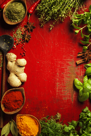 Herbs and spices. Fresh delicious ingredients for healthy cooking on rustic background, top view. Diet, cooking, clean eating or vegetarian food concept.の写真素材