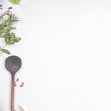Olive oil, balsamic vinegar, pepper and herbs on concrete background - cooking ingredients -- top view - space for text. Healthy food vegan or diet nutrition concept.の写真素材