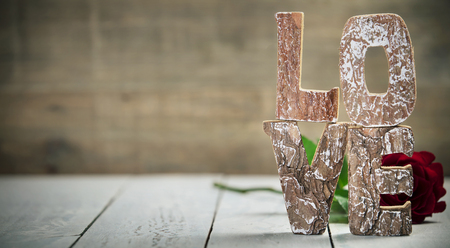 Valentine's Day concept.  Love wooden letters on rustic backgroundの写真素材
