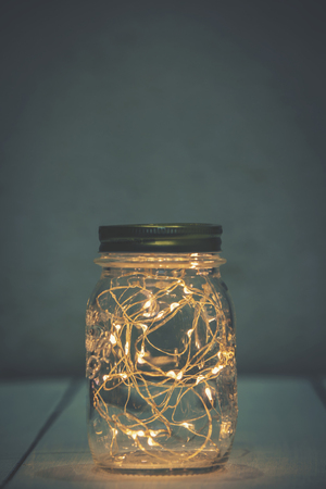 Christmas fairy lights in a mason jarの写真素材