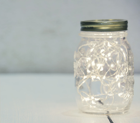 Christmas fairy lights in a mason jarの写真素材