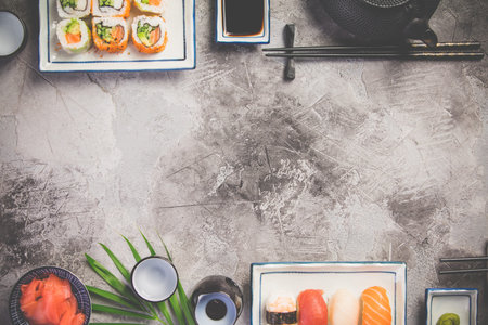 Flat-lay of sushi set on grey concrete background, horizontal compositionの写真素材