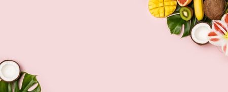 Creative flat lay with tropical fruits and plantsの写真素材