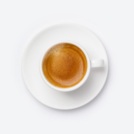 Cup of coffee on white background, flat lay, top viewの写真素材