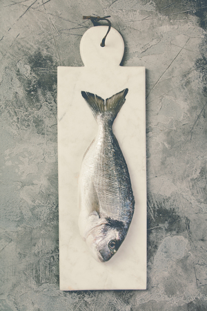 Delicious fresh sea bream fish, flat lay, top viewの写真素材