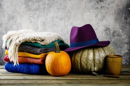 Autumn background on wooden tabel against old rust condition vintage wallの写真素材