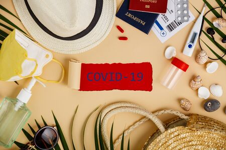 Coronavirus and travel concept. Passports, airplane tickets, sanitizer, thermometer and travel symbols flat layの写真素材