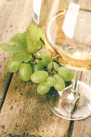 Wine composition with glass of wine and grape, close upの写真素材