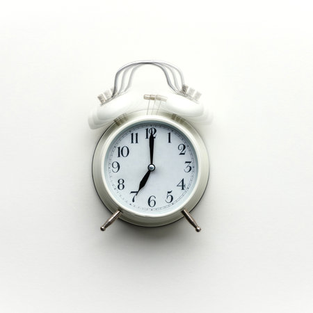 White alarm clock on white background, flat lay