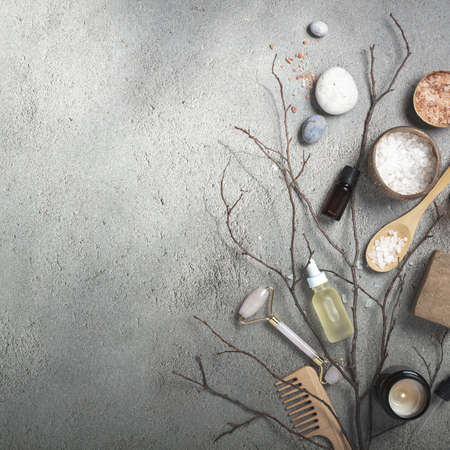 Natural SPA cosmetic products background, Composition with bottles of essential oils, sea salt and rose quartz roller, copy spaceの写真素材