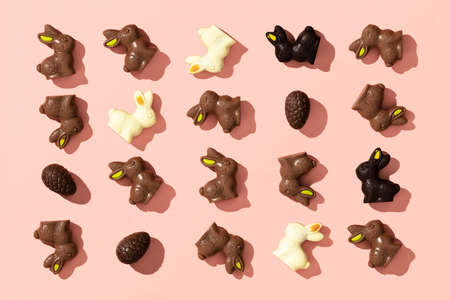 Chocolate Easter Eggs and Bunnies on pink background patternの写真素材