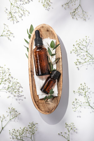 Herbal essential oils in wooden bowlの写真素材