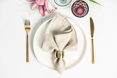 Elegant table setting with floral decor, flat layの写真素材