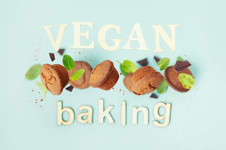 Chocolate muffins with mint leaves, vegan baking conceptの写真素材