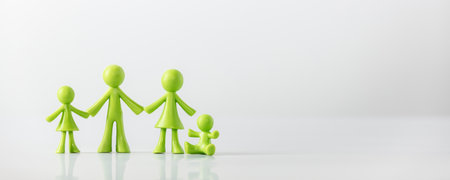 Green figures made of biodegradable plastic model of family with childrenの写真素材