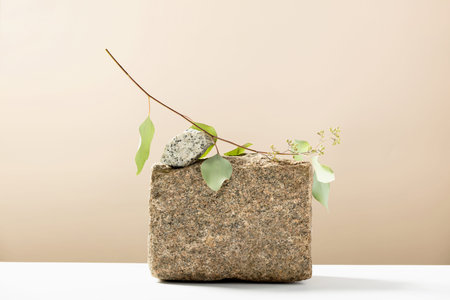 Stone podium for showing packaging and product on natural beige background, copy space