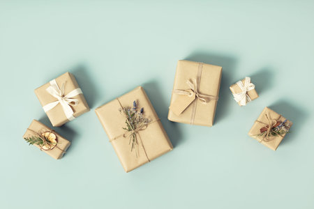 Christmas gift boxes on blue background flat lay