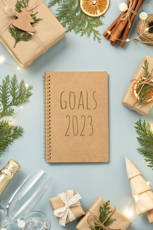 2023 Goals notebook, Natural color Christmas gift boxes on blue background, eco friendly trendy zero...