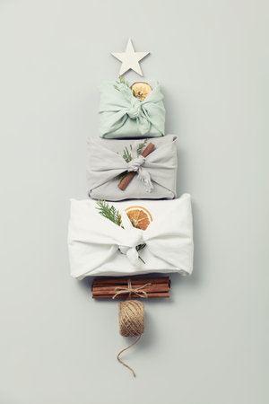 reusable sustainable gift wrapping in linen fabric. Furoshiki gifts. zero waste concept flat layの写真素材
