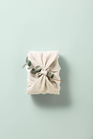 Zero waste, eco friendly hand made gift on blue background
