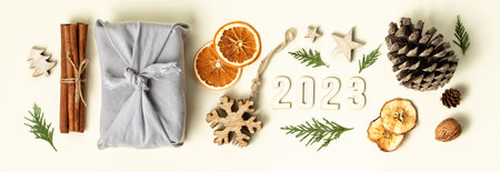 Natural color Christmas gift boxes on white background, eco friendly trendy zero waste packaging flat lay top view bannerの写真素材