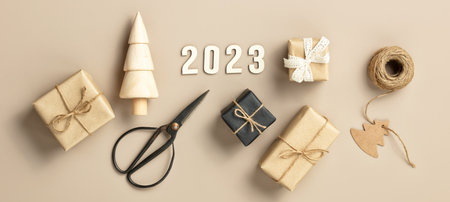 Natural color Christmas gift boxes on white background, eco friendly trendy zero waste packaging flat lay top view bannerの写真素材