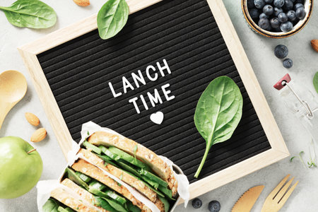 Lunch time letter board and healthy food flat layの写真素材