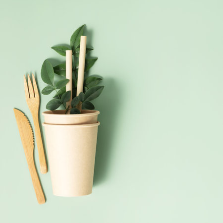 Eco composition with tableware on light green background copy spaceの写真素材