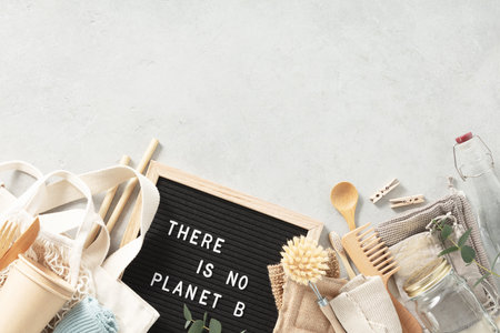 There is no planet b letter board and zero waste no plastic accessories on grey stone background