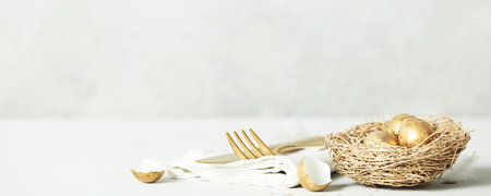 Easter table decorations on light grey background copy spaceの写真素材