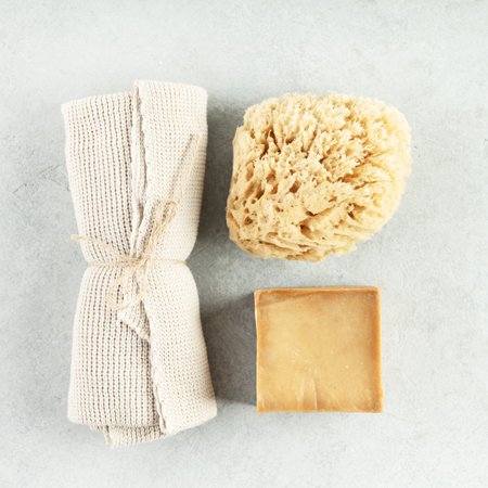 Top view photo of natural hand made soap bar and eco friendly personal care products on grey backgroundの写真素材